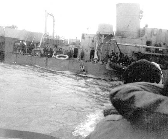 (Right: crew of the Alexander Hamilton abandons ship after being torpedoed.)